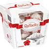 Weißer Kartonverpackung mit Raffaello Pralinen und einer dekorativen roten Schleife.