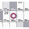 Magnetring auf einem Kalenderblatt, das den 18. und 29. eines Monats zeigt.