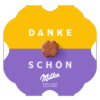 Verpackung der Milka Pralinen mit der Aufschrift "Danke schön" und einer blumenförmigen Praline.
