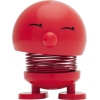 Dekorationsfigur Baby Bimble in Rot mit einem lächelnden Gesicht und federndem Körper.
