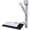 Wall-mounted PC workplace with adjustable monitor arm and keyboard tray folded against the wall.