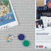 Pinnwand aus Textilfaser mit Metallgitter, ergänzt durch verschiedene farbige Pins und Broschüre.