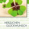 Glückwunschkarte mit vierblättrigem Kleeblatt und Aufschrift „Herzlichen Glückwunsch“.