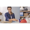 Roter und blauer Tischabroller mit Wellenmesser auf einem Schreibtisch in Büroatmosphäre.