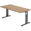 Hammerbacher Schreibtisch mit nussbaumfarbener Oberfläche und höhenverstellbarem Gestell.