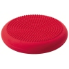 Rotes, rundes Sitzkissen mit einer Seite mit Noppen und einer glatten Oberfläche.