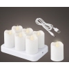 Set aus sieben LED-Teelichtern mit 3D-Flammeneffekt und USB-Ladekabel.