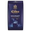 Kaffeebehälter mit blauer Verpackung, Aufschrift "Gourmet" und einem dampfenden Kaffeebecher.