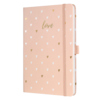 Rosa Notizbuch mit goldenen und weißen Herzen und dem Schriftzug "love" auf dem Cover.
