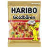 Packung mit HARIBO Goldbären in Goldfolie, mit bunten Fruchtgummis und einem lächelnden Bären.