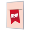 Roter Bilderwechselrahmen DIN A1 mit Aufschrift "NEU!" auf einem neutralen Hintergrund.