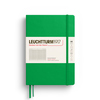 Kariertes, grünes Hardcover-Notizbuch im DIN A5-Format mit Gummiband und Etikett.