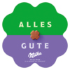 Klebblattförmige Geschenkverpackung mit der Aufschrift "ALLES GUTE" und einer Praline in der Mitte.