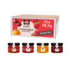 Kartonverpackung mit vier Sorten Konfitüre in Portionsgläsern.