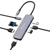 USB-C-Hub mit mehreren Anschlüssen, darunter HDMI, USB-A, SD-Kartenleser und Kabel.