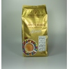Goldene Packung mit Kaffee, 100% Arabica, mit bunter Tasse und Inhaltsangaben vorne.