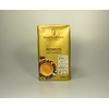 Goldfarbener Kaffeebeutel mit buntem Design und der Aufschrift "NOMOS 100% ARABICA".