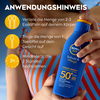Sonnenlotion mit Anwendungshinweisen auf einem blauen Fläschchen in einer Sommerumgebung.