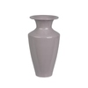 Lila Vase aus Eisen mit einer Höhe von 23 cm und einem Durchmesser von 12 cm.
