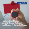 Roter Ergo-Magnet mit Hand im Fokus, zeigt die spezielle Kleberverbindung zur Kunststoffkappe.