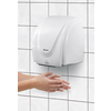 Bartscher Handtrockner an einer Fliesenwand mit einer Hand, die darunter gehalten wird.