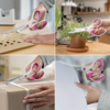 Asymmetrische, pinke Universalschere in Nutzungssituationen wie Schneiden von Papier und Pflanzen.