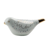 Dekorationsfigur in Form eines Vogels mit der Aufschrift "Immer bei dir" und goldenen Akzenten.