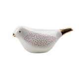 Dekorationsfigur eines Vogels in Weiß mit rosa Punkten und goldenem Schnabel.