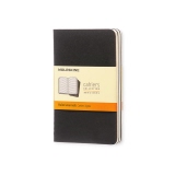 Schwarzes Moleskine Cahier Notizheft im Set mit orangefarbener Umverpackung.
