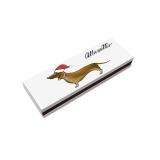 Streichholzschachtel mit Dackel-Illustration und Weihnachtsmütze auf weißem Hintergrund.