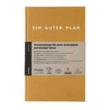 Buchkalender in bernsteinfarbigem Cover mit dem Titel 'EIN GUTER PLAN' und Markierungsdetails.