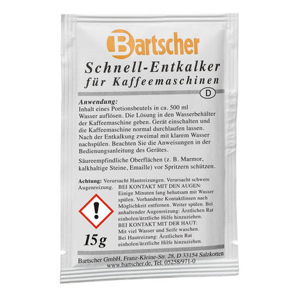 Sachets Entkalker für Kaffeemaschinen mit Anweisungen und Warnhinweisen auf der Verpackung.