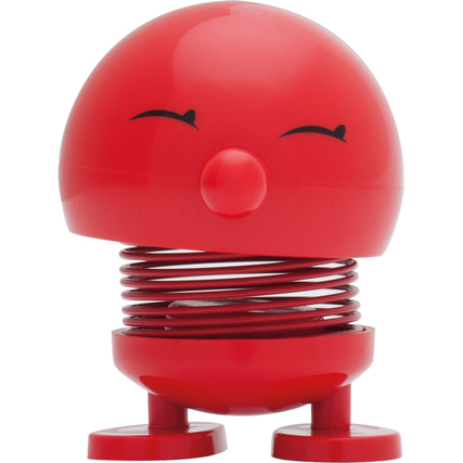 Dekorationsfigur Baby Bimble in Rot mit einem lächelnden Gesicht und federndem Körper.