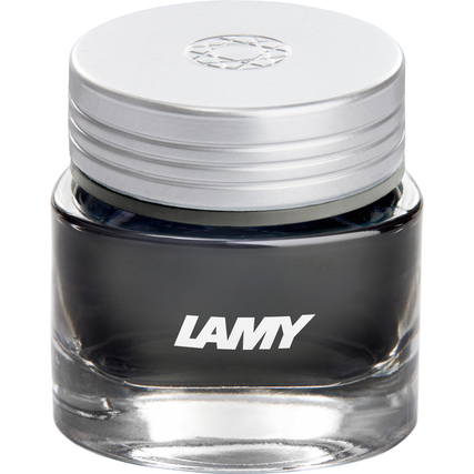 Glastiegel mit grauer Tinte und silbernem Deckel, beschriftet mit 'LAMY'.