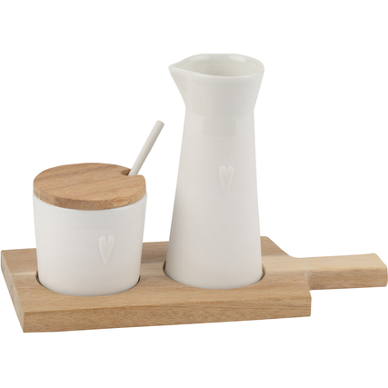 Servierset mit einer Karaffe und einer Schale auf einer Holzplatte, beide in Weiß.