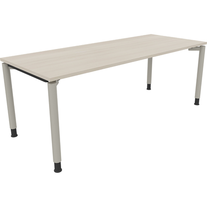 Schreibtisch mit hell akaziefarbenem Holz und silberaluminiumfarbigen Rundrohrbeinen.