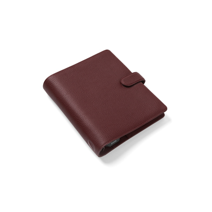 Roter Organizer aus genarbtem Leder im DIN A5 Format mit Druckknopfverschluss.
