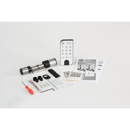 Elektronisches Türschloss mit Keypad, Montagezubehör und Anleitung auf heller Fläche dargestellt.