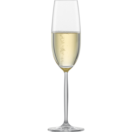 Sektglas mit Moussierpunkt und konvex geformtem Stiel, gefüllt mit Sekt.