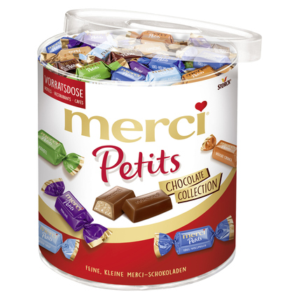 Runde Vorratsdose mit merci Petits Schokolade in verschiedenen Sorten, einzeln verpackt.