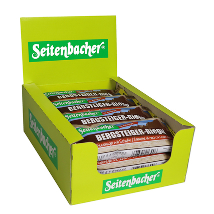 Nussriegel in einer offenen Verkaufsverpackung in einer gelben Box.