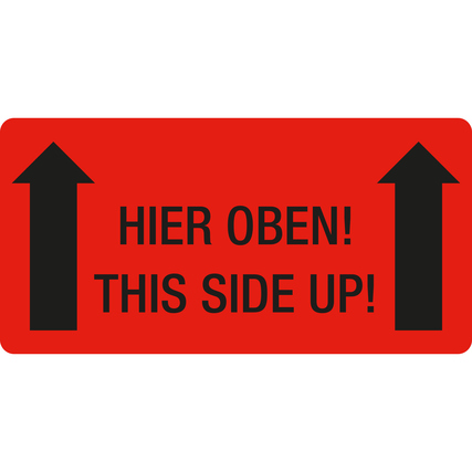 Rotes Hinweisetikett mit schwarzem Text "HIER OBEN! THIS SIDE UP!" und Pfeilen nach oben.