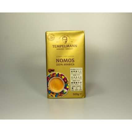 Goldfarbener Kaffeebeutel mit buntem Design und der Aufschrift "NOMOS 100% ARABICA".