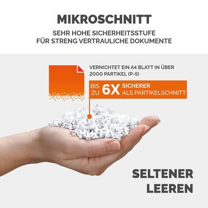 Hand, die zerknittertes Papier in Mikroschnittform mit Hinweis auf sehr hohe Sicherheitsstufe hält.