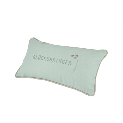 Rechteckiges Kissen in mintgrün mit dem Schriftzug "GLÜCKSBRINGER" und einem kleinen Motiv.