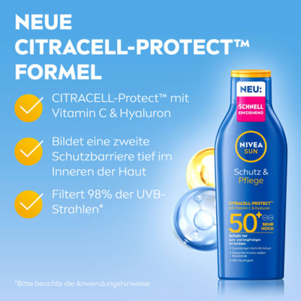 Sonnenlotion in blauer Flasche mit Hinweisen zu Schutzformel und UV-Filter gegen Sonnenstrahlen.