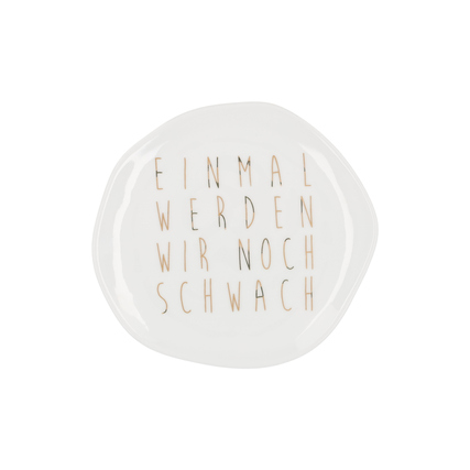 Kleiner, organisch geformter Porzellanteller mit goldener Schrift "Einmal werden wir noch schwach".