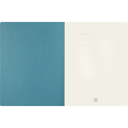 Offene Ansicht des Moleskine Notizhefts mit einem blauen Einband und elfenbeinweißen Seiten.