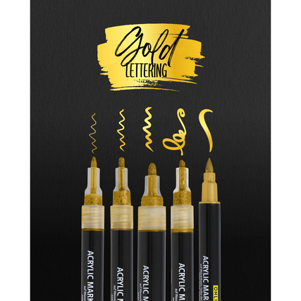 Set aus fünf goldenen Acrylmarkern für Lettering auf schwarzem Hintergrund.