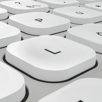 Nahaufnahme der Tasten einer grauen/weißen Tastatur mit konkav geformten Tasten.